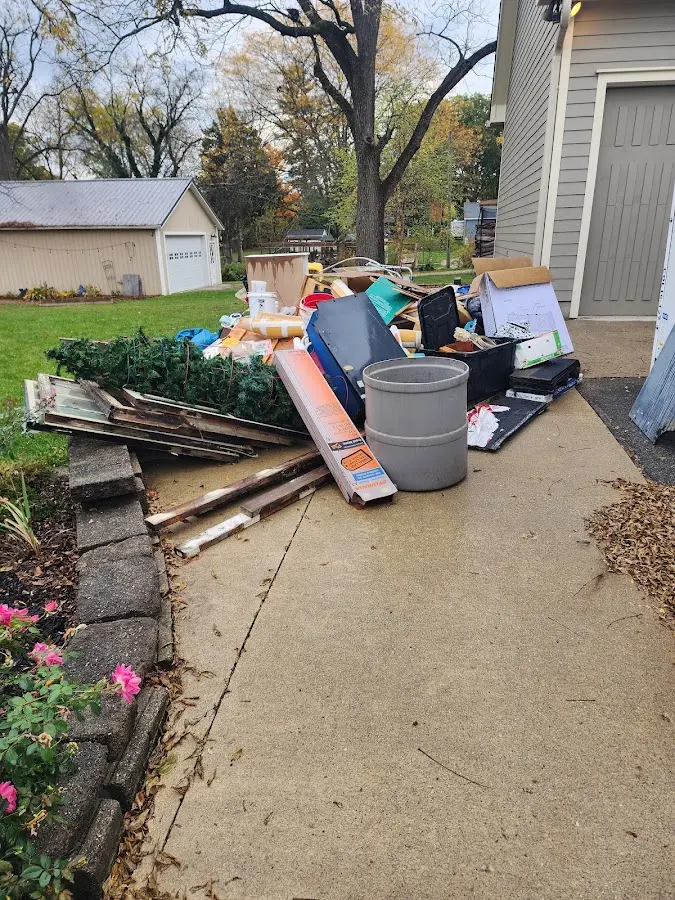 Dumpster being loaded with debris for Commercial Dumpster Rental in Forest Acres